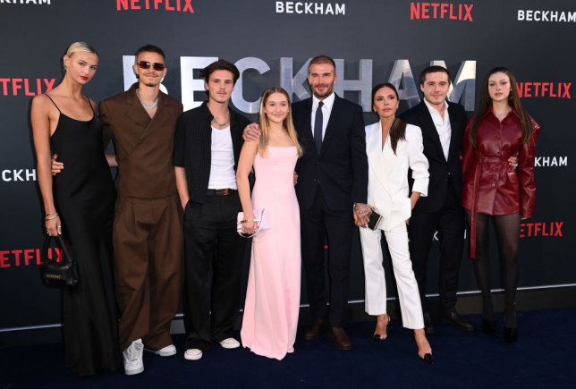 The Beckham family pose for a photo at a red carpet premiere