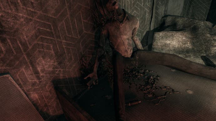 A screenshot from Hollowbody shows a body in the corner of a room. Its mouth is open, a strange, dark substance dripping from its face, painting the wall behind it and the floor between its legs