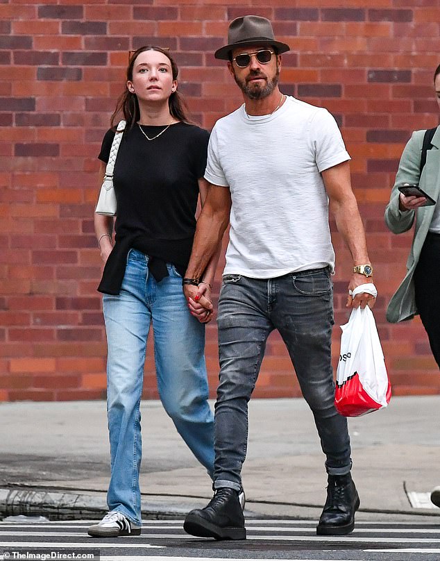 The loved-up couple appeared to be on a grocery run as the Beetlejuice Beetlejuice star carried a white plastic bag