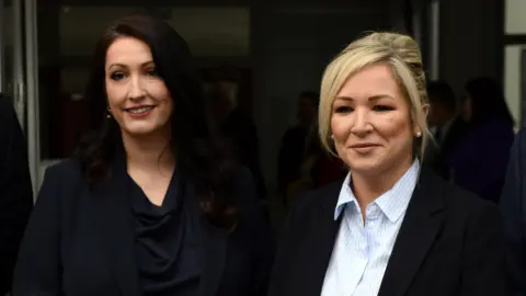 EPA First Minister Michelle O'Neill and Deputy First Minister Emma Little Pengelly smiling for cameras - both are wearing dark coloured blazers and formalwear. This is an archive photo