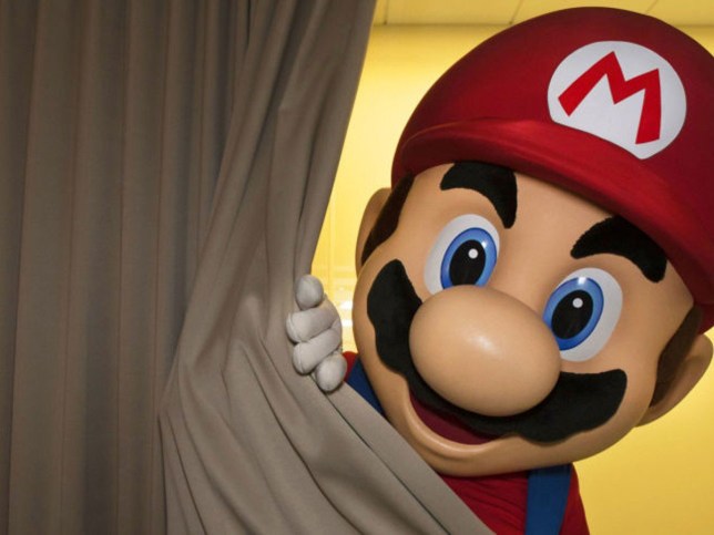 Super Mario looking out from behind a curtain