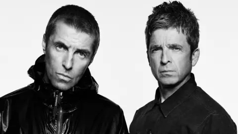 Simon Emmett A black-and-white photo of Liam and Noel Gallagher 