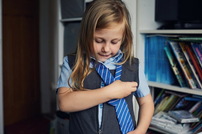 School child getting ready for school