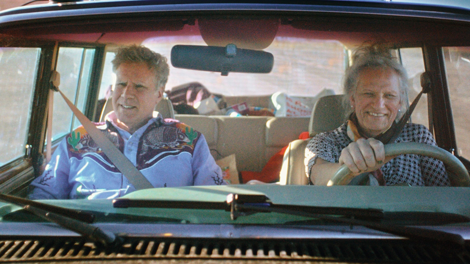 Image may contain Will Ferrell Adult Person Driving Transportation Vehicle Accessories Bag Handbag Face and Head