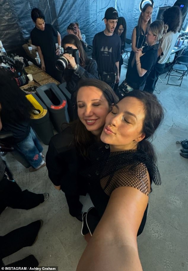 Decked out in a lacy silver outfit, she snapped a selfie with her friend, the fashion designer Alice Vaillant, backstage at the latter's show