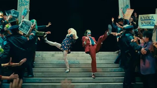 Joker and Harley Quinn dancing on the steps