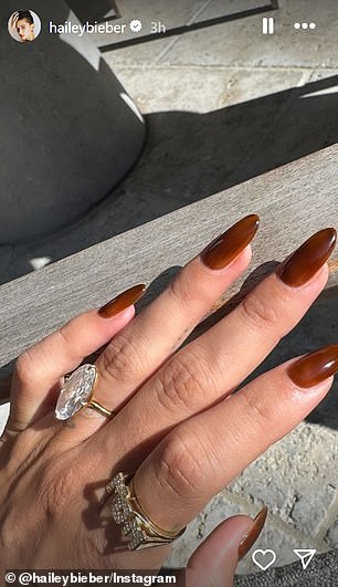 Days later, Hailey shared a photo of her freshly manicured hand as she rocked a $2k 'mom' ring