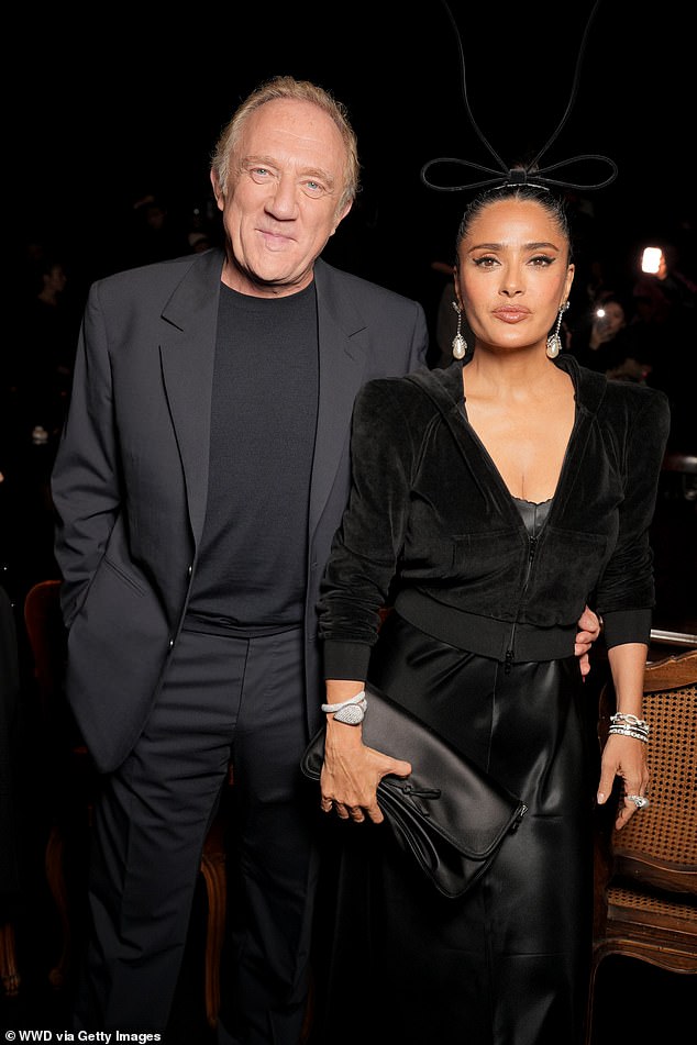 Pinault and Salma Hayek matched in black at the fashion event