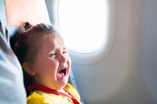 Crying children pictured on board a flight