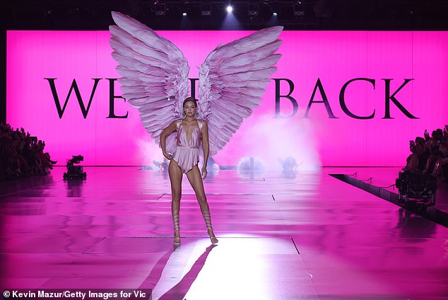 Gigi was pictured on the runway in front of a message that read 'Welcome back'