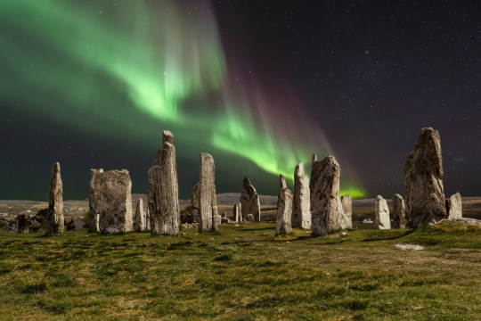 The Callanish Stones are an arrangement of standing stones placed in a cruciform pattern with a central stone circle. They were erected in the late Neolithic era, and were a focus for ritual activity during the Bronze Age. They are near the village of Callanish on the west coast of Lewis in the Outer Hebrides, Scotland.