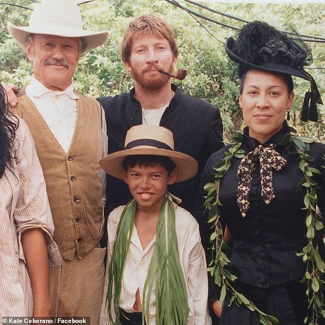 Taking to Facebook, the Brave hitmaker shared a photo that showed her posing alongside Kris and co-star David Wenham  on set for the 1999 film Molokai