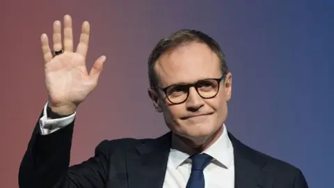 PA Media Conservative Party Leadership candidate Tom Tugendhat waves at the crowd during a speech at the final day of the Conservative Party Conference in