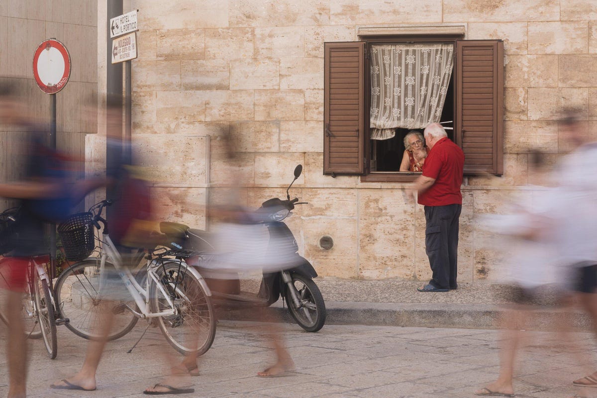 People walking in the foreground of a beautiful cityscape