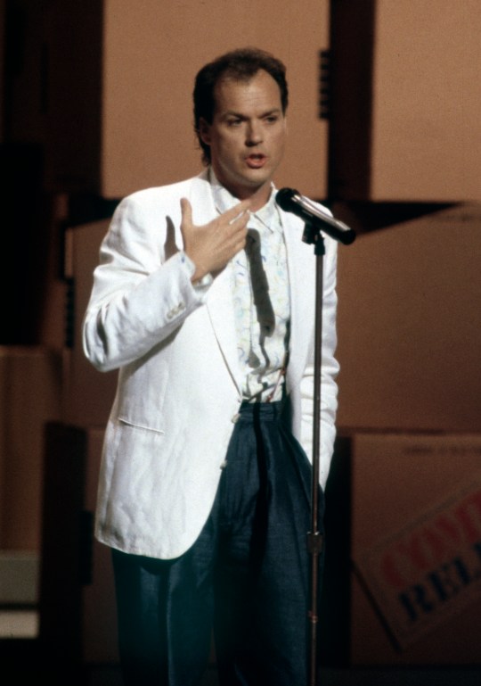 Michael Keaton on stage at the Comic Relief Fundraising Concert in 1986