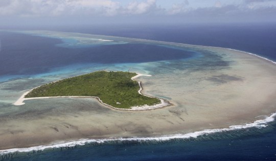 Bikini Atoll, Marshall Island - File photo taken in August 2011 shows the Bikini Atoll in the Marshall Islands in the Pacific Ocean. The dark-colored bay-like area (center, upper) is a crater created by a 1954 U.S. hydrogen bomb test. (Photo by Kyodo News Stills via Getty Images)