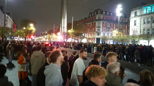 BEST QUALITY AVAILABLE Handout photo issued by Artur Martins of people waiting in Dublin for a non-existent Halloween parade. Groups congregated on O'Connell Street on Halloween night after posts online suggested there would be a spectacle there from 7pm. Just before 8pm, Gardai posted on social media site X to appeal to people to leave. Picture date: Thursday October 31, 2024. PA Photo. See PA story IRISH Halloween. Photo credit should read: Artur Martins/PA Wire NOTE TO EDITORS: This handout photo may only be used in for editorial reporting purposes for the contemporaneous illustration of events, things or the people in the image or facts mentioned in the caption. Reuse of the picture may require further permission from the copyright holder.