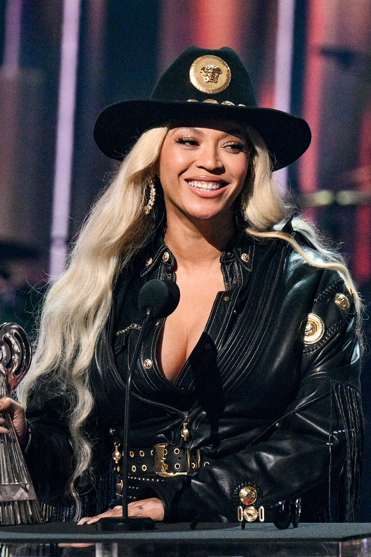 Image may contain Beyonc Clothing Coat Jacket Adult Person Hat Blonde Hair Face Head and Performer