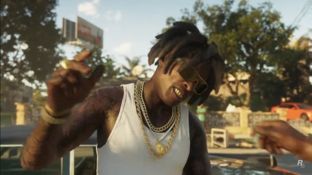 GTA 6 screenshot from trailer showing a character wearing a white vest and gold necklaces