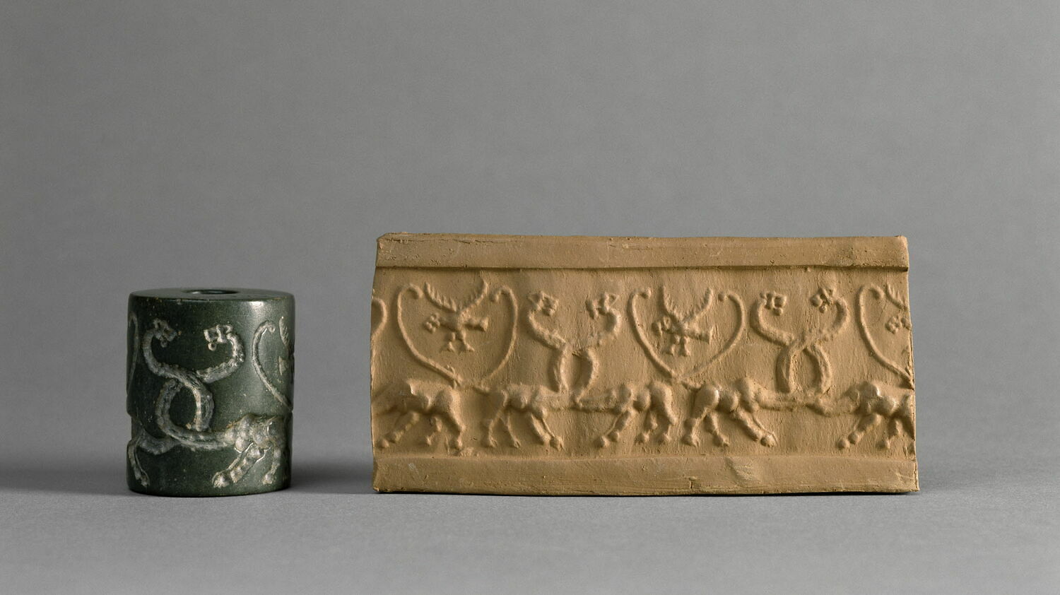 A cylinder seal, left, and its design is imprinted on clay. Cylinder seals were made out of stone and are another piece of the puzzle in understanding the origins of writing in Mesopotamia