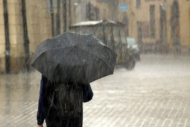 Man with umbrella in rain