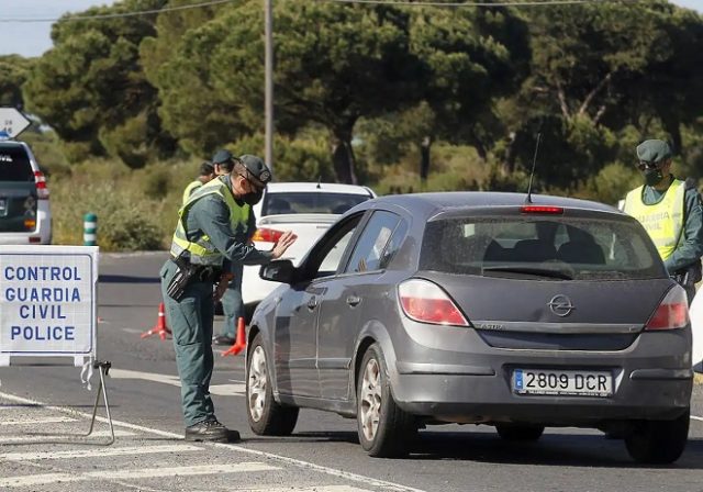 Guardia Civil Trafico asks driver for documents