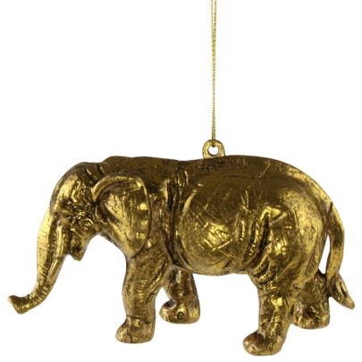 Guldfarvet ornament formet som en elefant.
