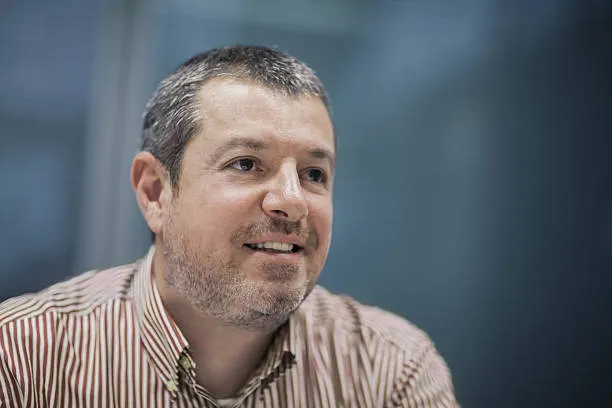 portrait-of-businessman-smiling-in-business-office