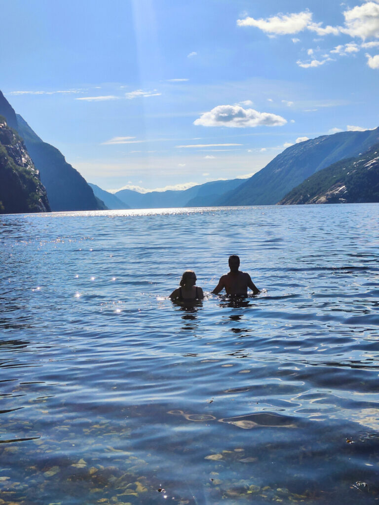 enjoying friluftsliv in Norway, couple swimming in the fjord