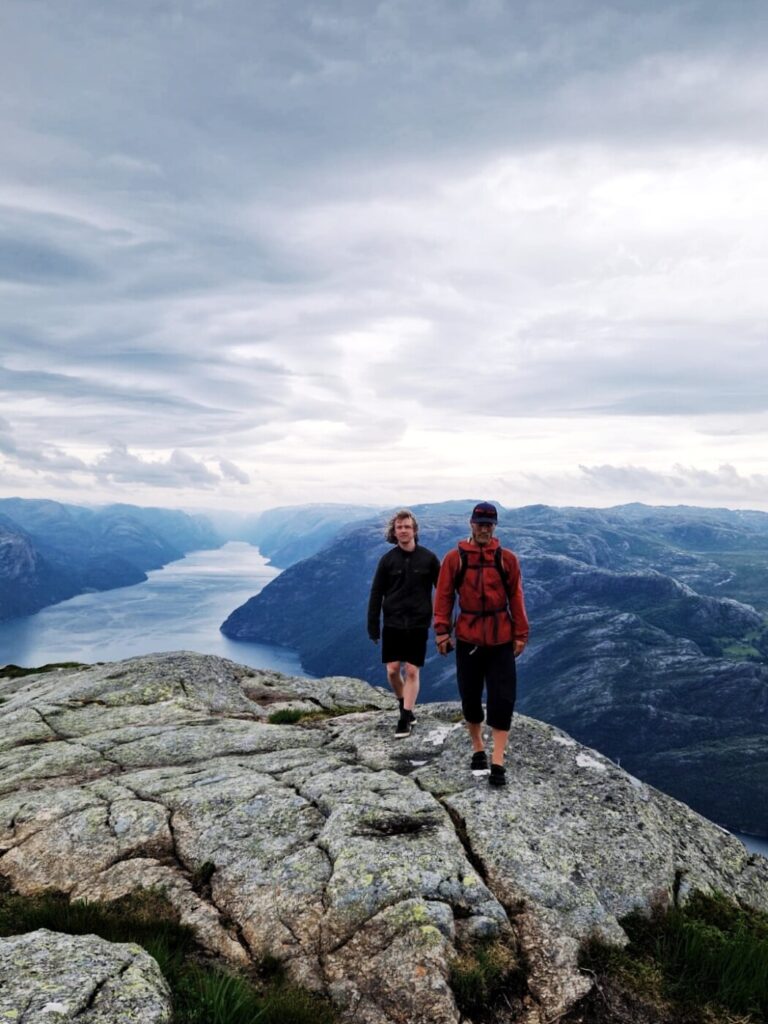 preikestolen hike Norway. 2 people exploring nature in Norway