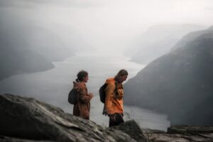 the right to roam in norway - 2 people on a hike above the fjord