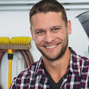 Male carpenter standing with arms crossed