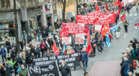 Första majdemonstration, röda flaggor och banderoll mot Nato.