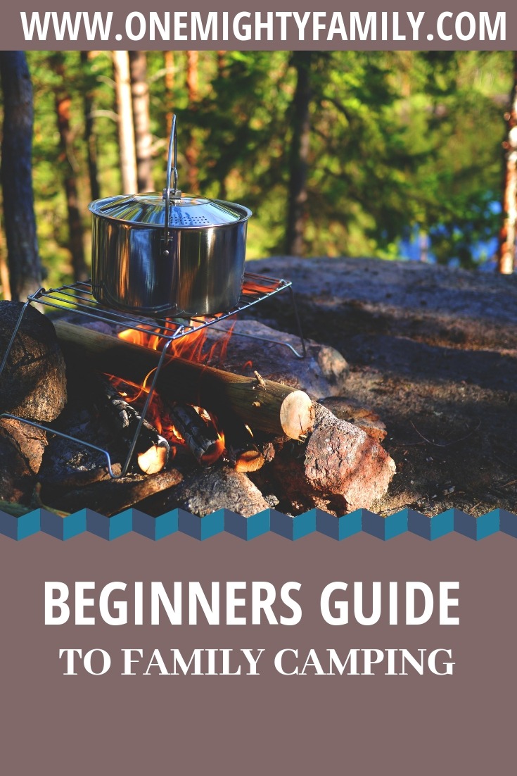 a pot set over a campfire, and the text: beginners guide to family camping