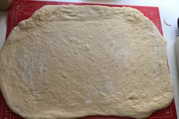 Dough rolled out to show how bit it gets when its rolled out