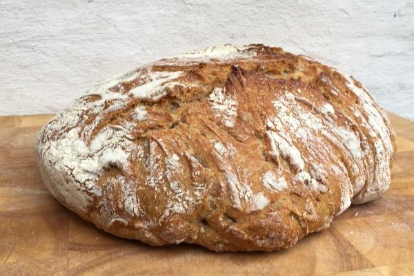 Bread on a wonden board with a white background