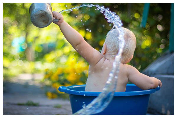 toddler playing with water