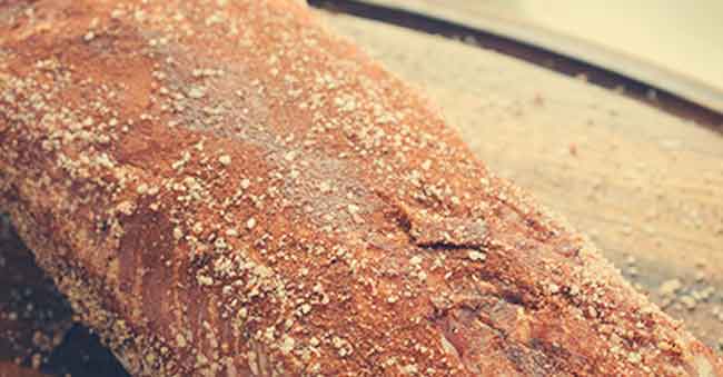 putting spices on the meat for Pulled Pork