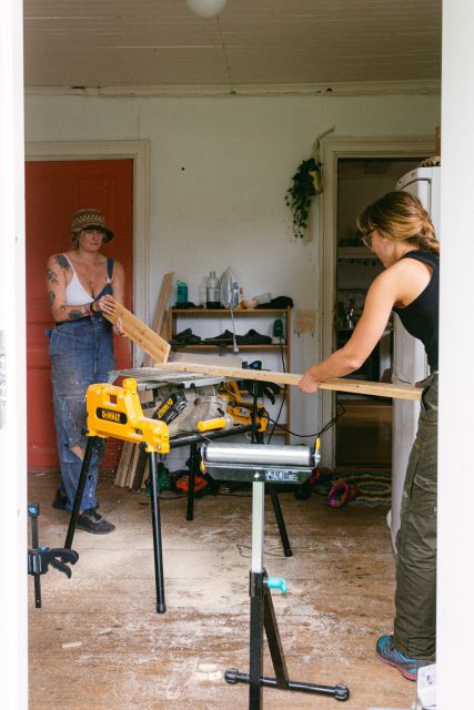 Pop-up commune participants building connections through working together on community tasks