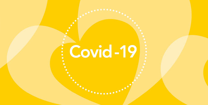 Covid-19 i cirkel med gula hjärtan som bakgrund