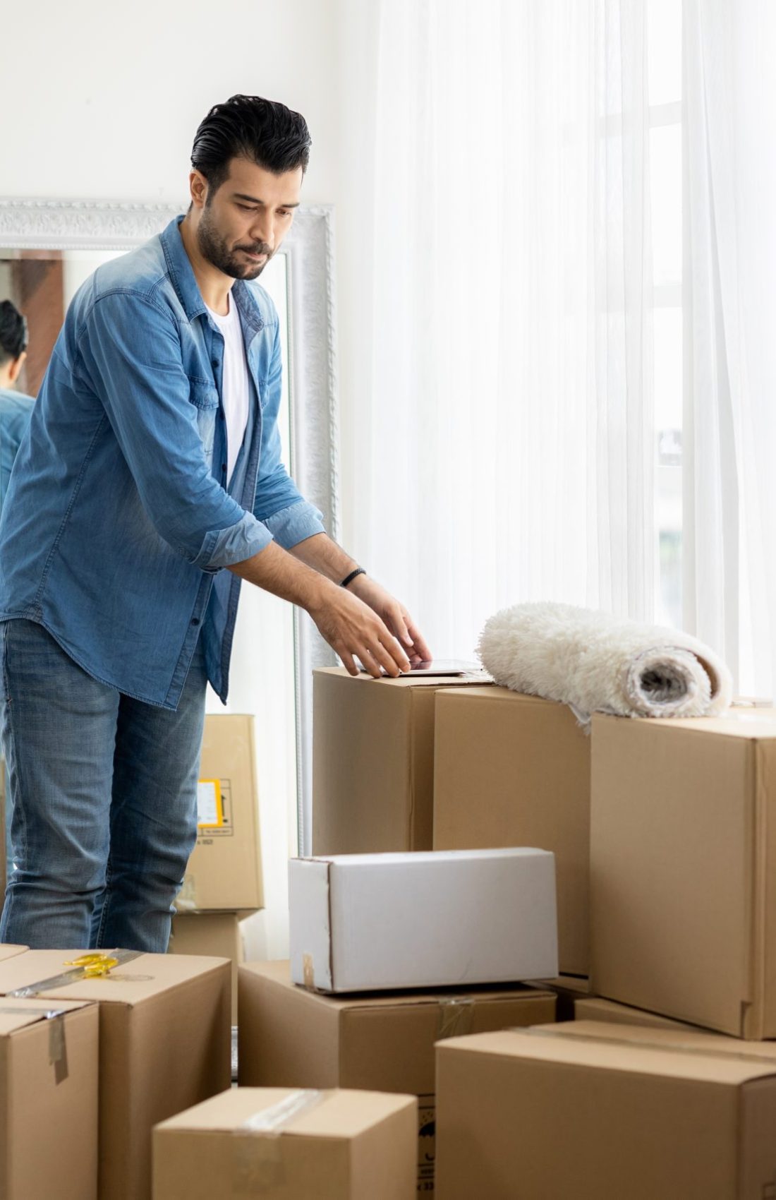 Young,Man,Just,Moving,New,House.,He,Unpacking,Parcel,Box