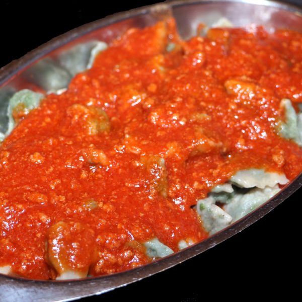 Vegetable ravioli with meat sauce
