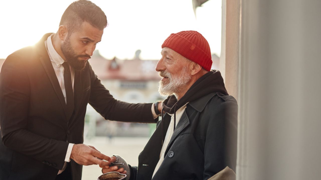 Man having compassion giving to another man