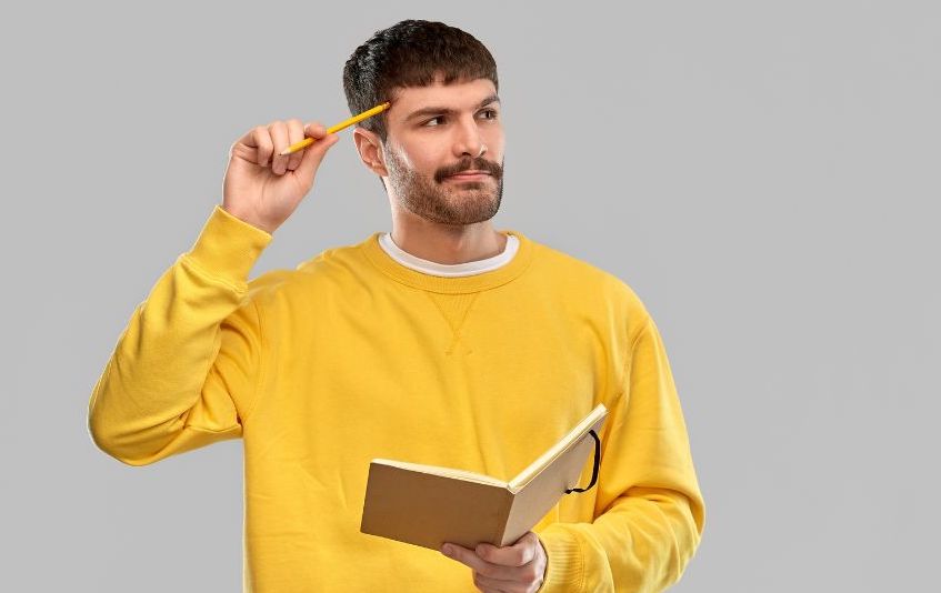 Man, wondering if he has an optimistic mindset