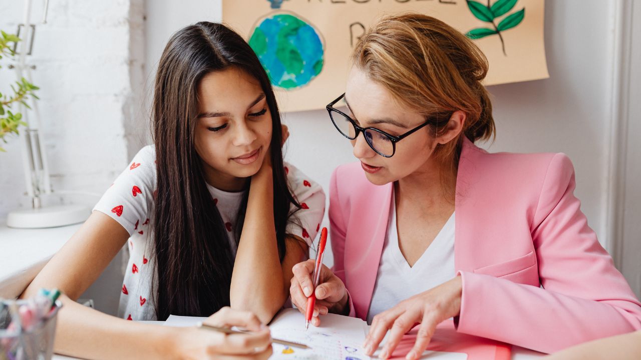 Woman having faith in a little girls potential