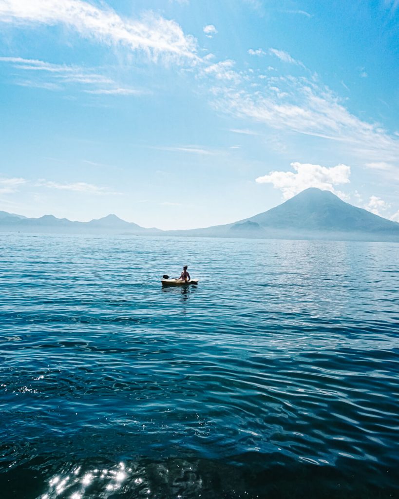 woman in Kayak  - activity part of the Lake Atitlan travel guide and one of the best things to do and enjoy the lake atitlan