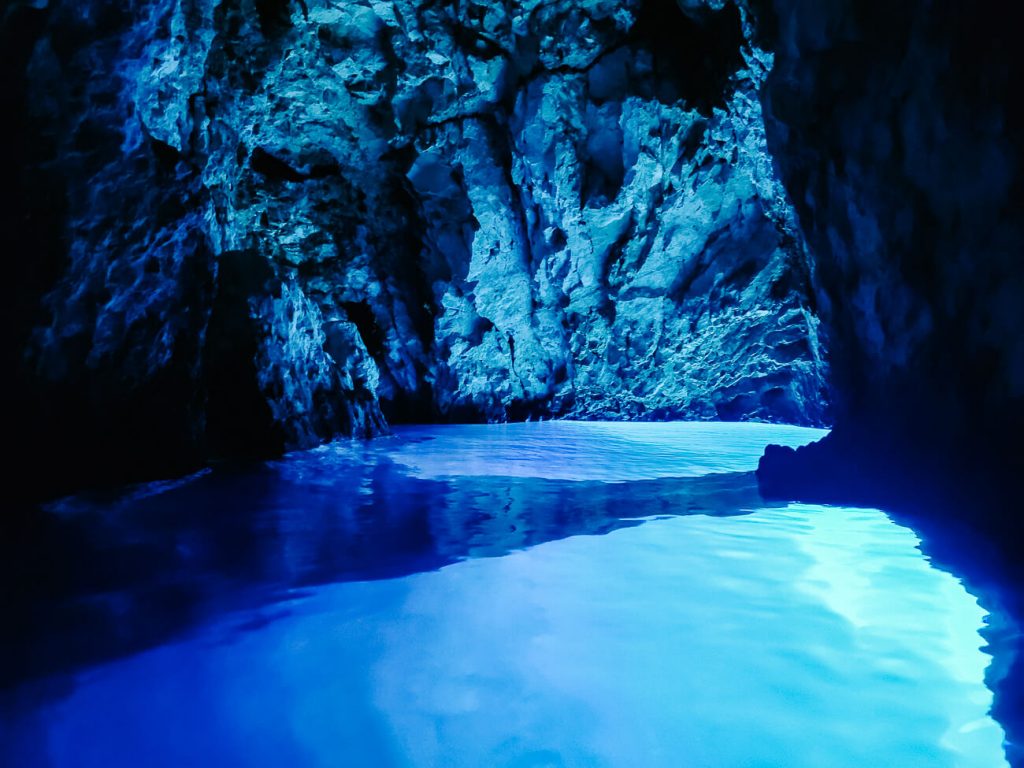 Blue cave, one of the stunning places you visit during a sail croatia cruise