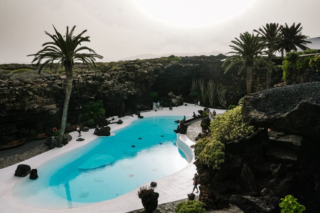 Swimming pool with palm trees in Jameos de Agua, one of the most famous things to do on Lanzarote.