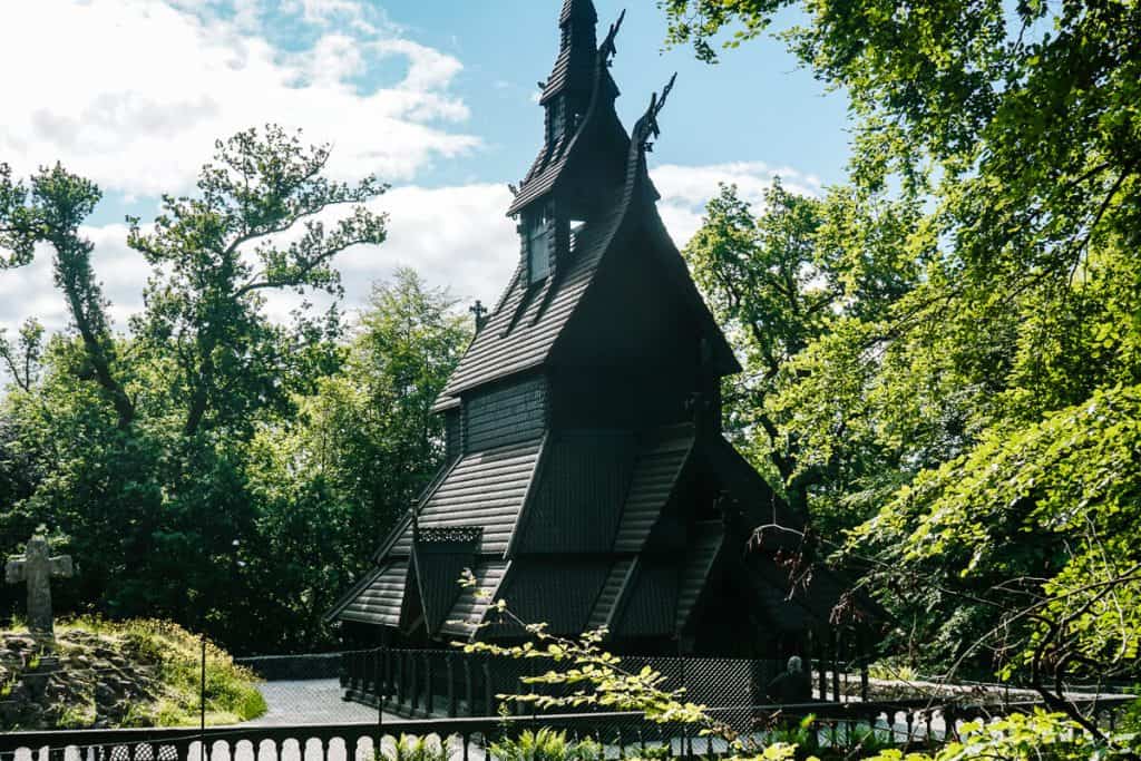 One of the things to do around Bergen in Norway is to visit the Fantoft Stave Church. A stave church is a wooden church with a typical architectural style that you only find in Scandinavia, a mix of Christianity and elements from the Viking Age.