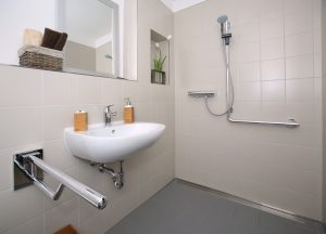 an accessible bathroom with roll in shower